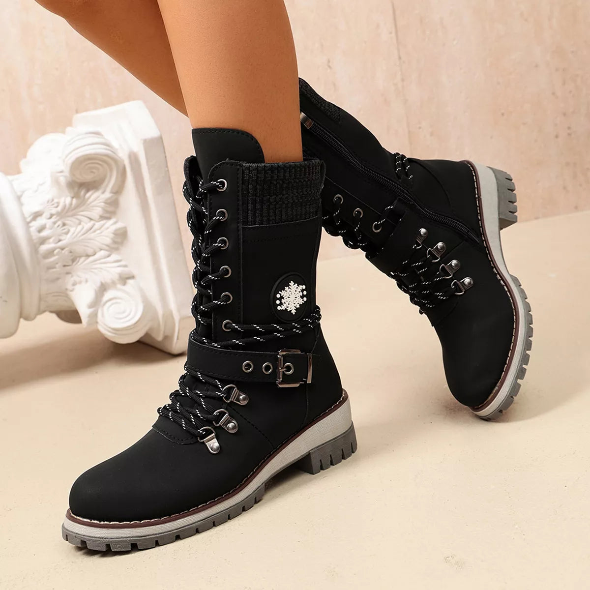 Black lace-up boots shown in front view