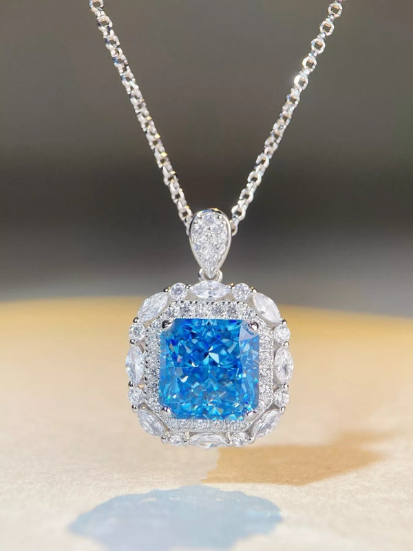 Blue rectangular pendant necklace with clear stone border and silver-tone chain, front view