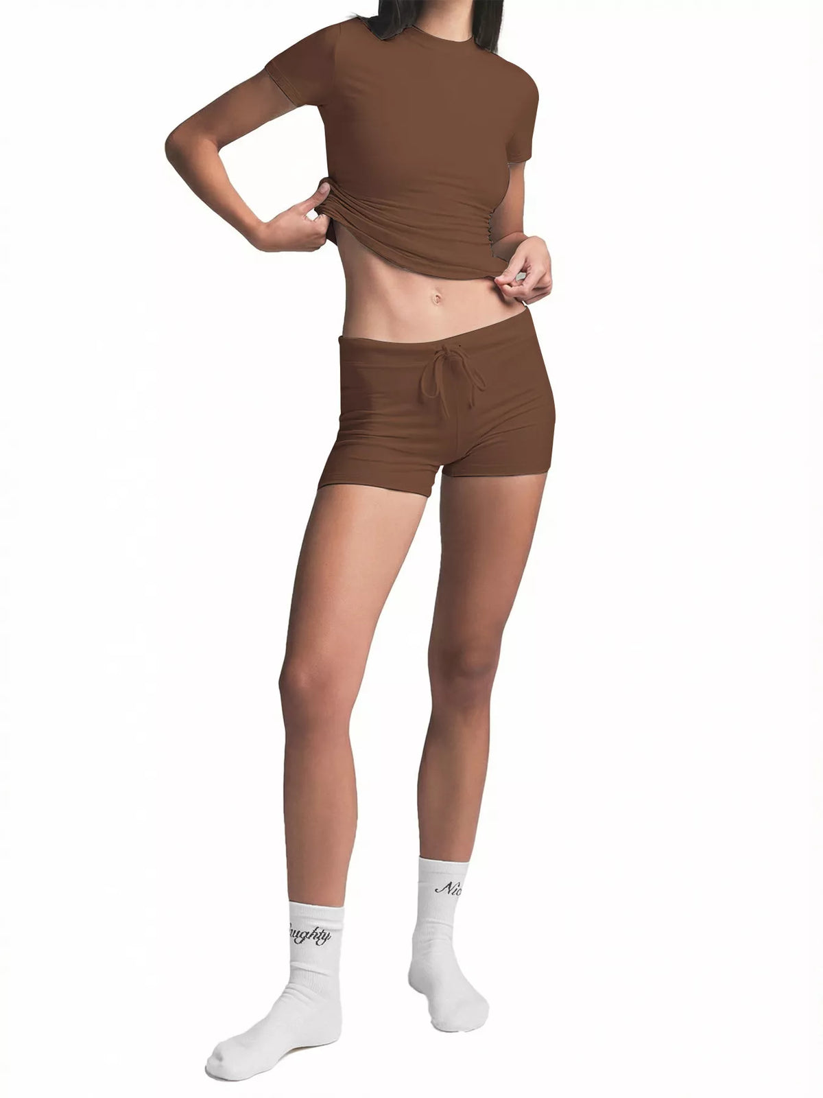 Woman modeling brown ribbed crop top and shorts set, standing pose