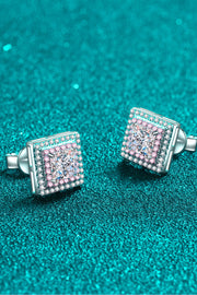 Pair of square stone studs angled to show their settings