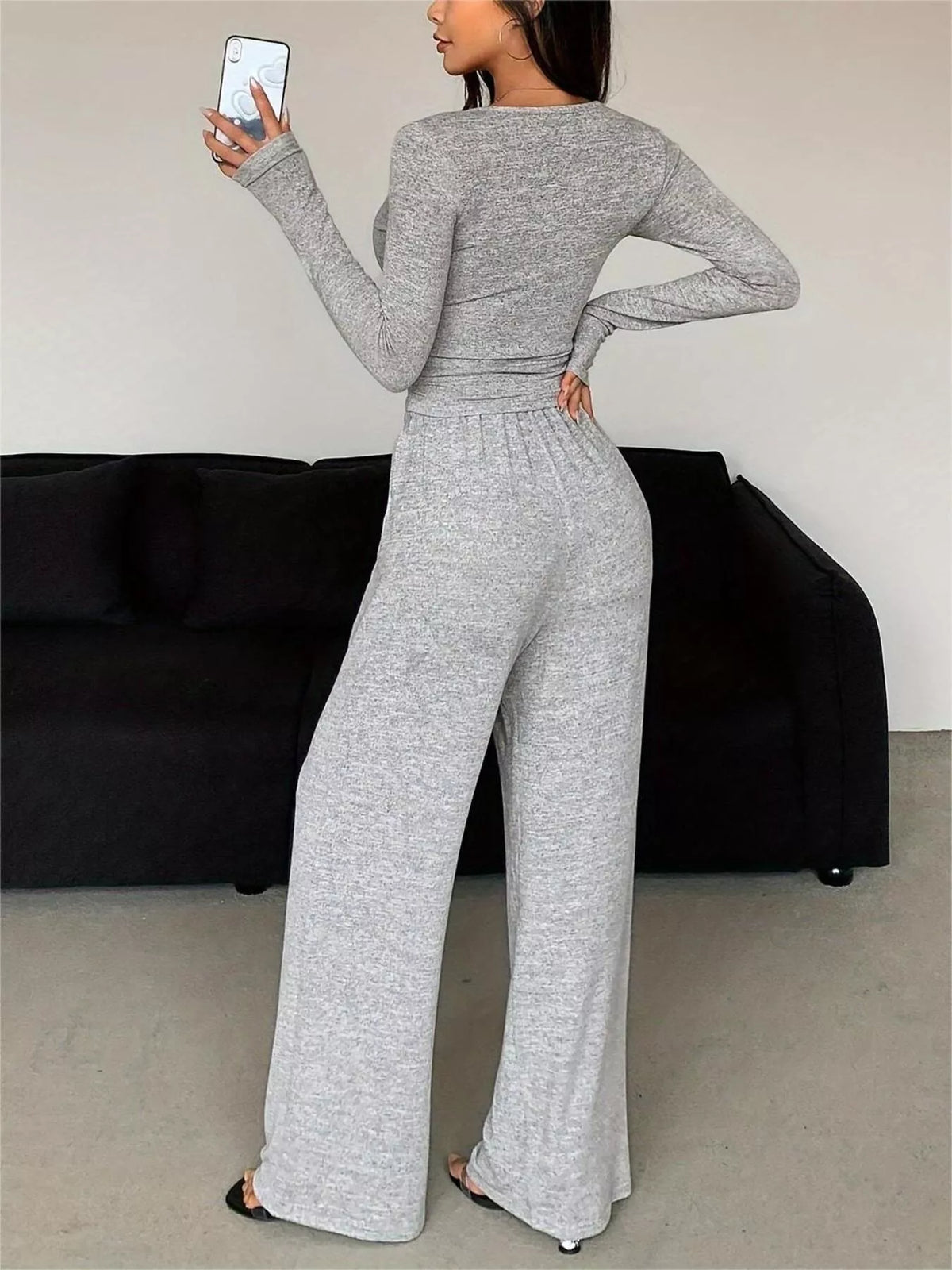 Rear view of light grey long-sleeve cropped top and matching wide-leg pants