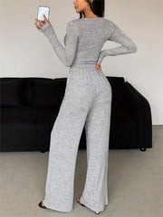 Rear view of light grey long-sleeve cropped top and matching wide-leg pants