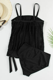 Back of black tankini top arranged flat with straps and matching briefs.