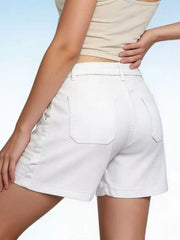Rear angled view of white denim shorts showing two patch pockets and belt loops