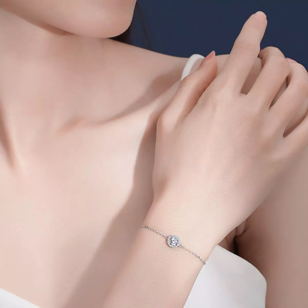 Fine silver moissanite bracelet worn on a wrist in a close lifestyle view