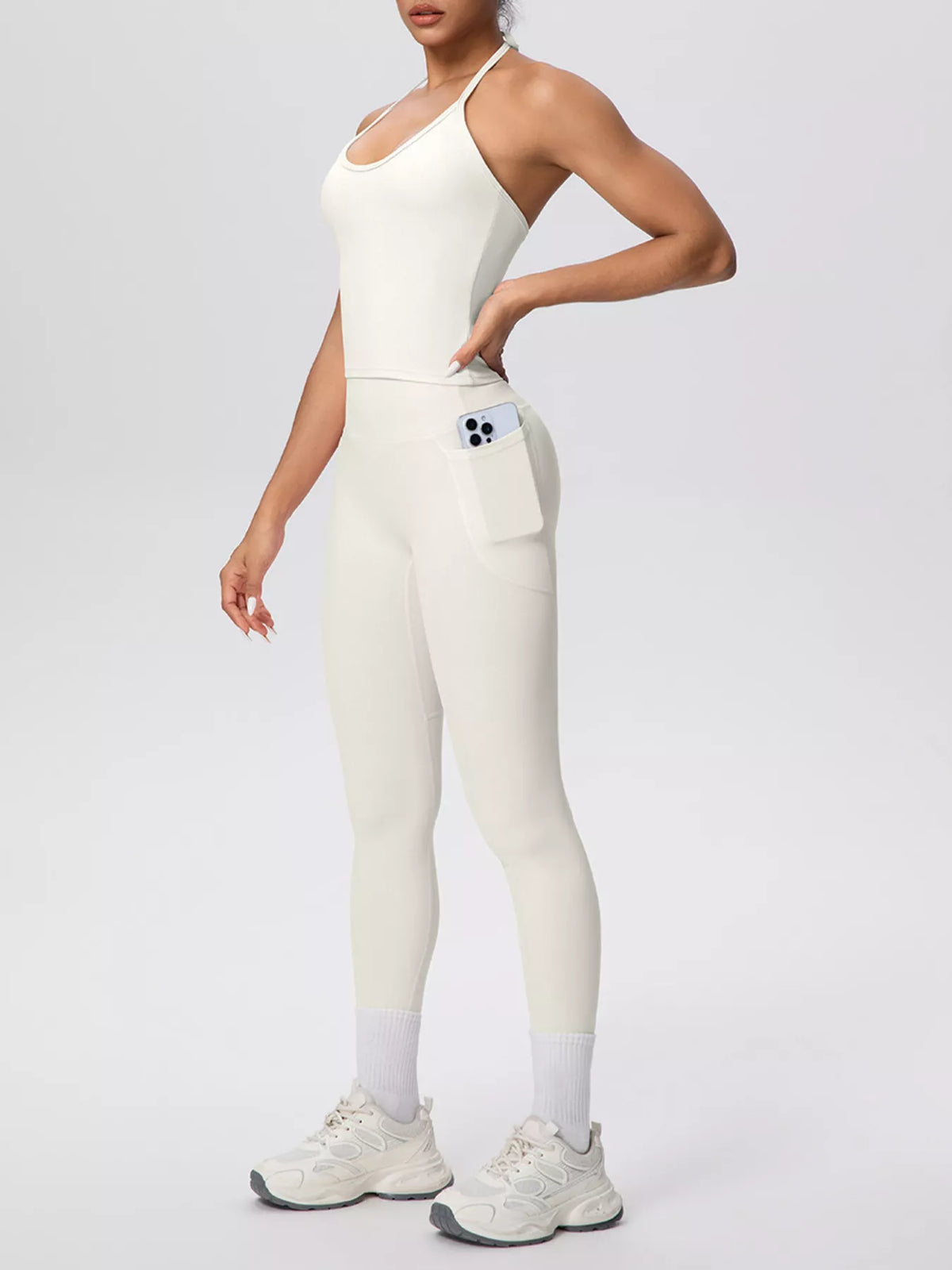 Front view of halter neck cami and high-waisted leggings active set