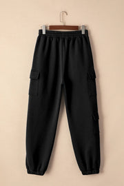 Back view of black joggers with elastic waist and cargo pockets