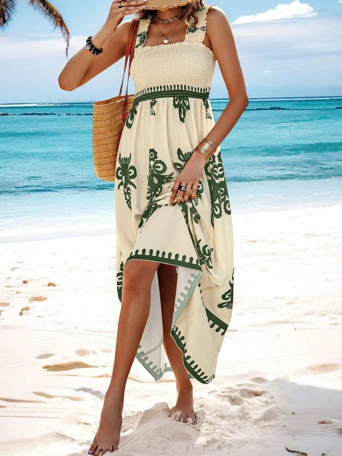 Model wearing cream maxi dress with green floral pattern