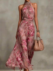 Model wearing a rose-pink floral sleeveless maxi dress.