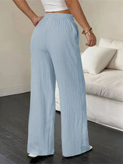 Back view of light-blue wide-leg pants with wide flowing legs