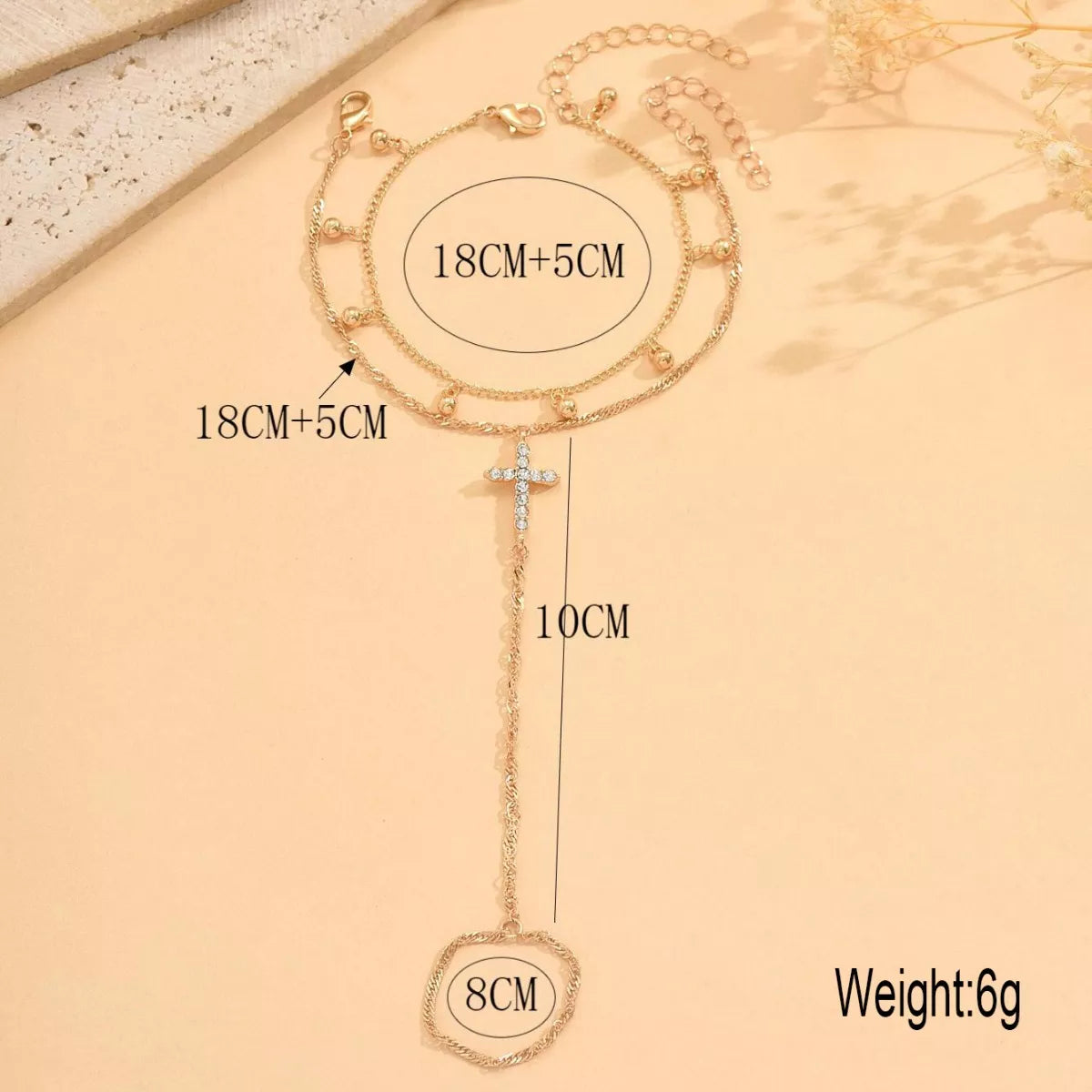 Measurement photo of cross bracelet with 18 cm chain and 5 cm extension