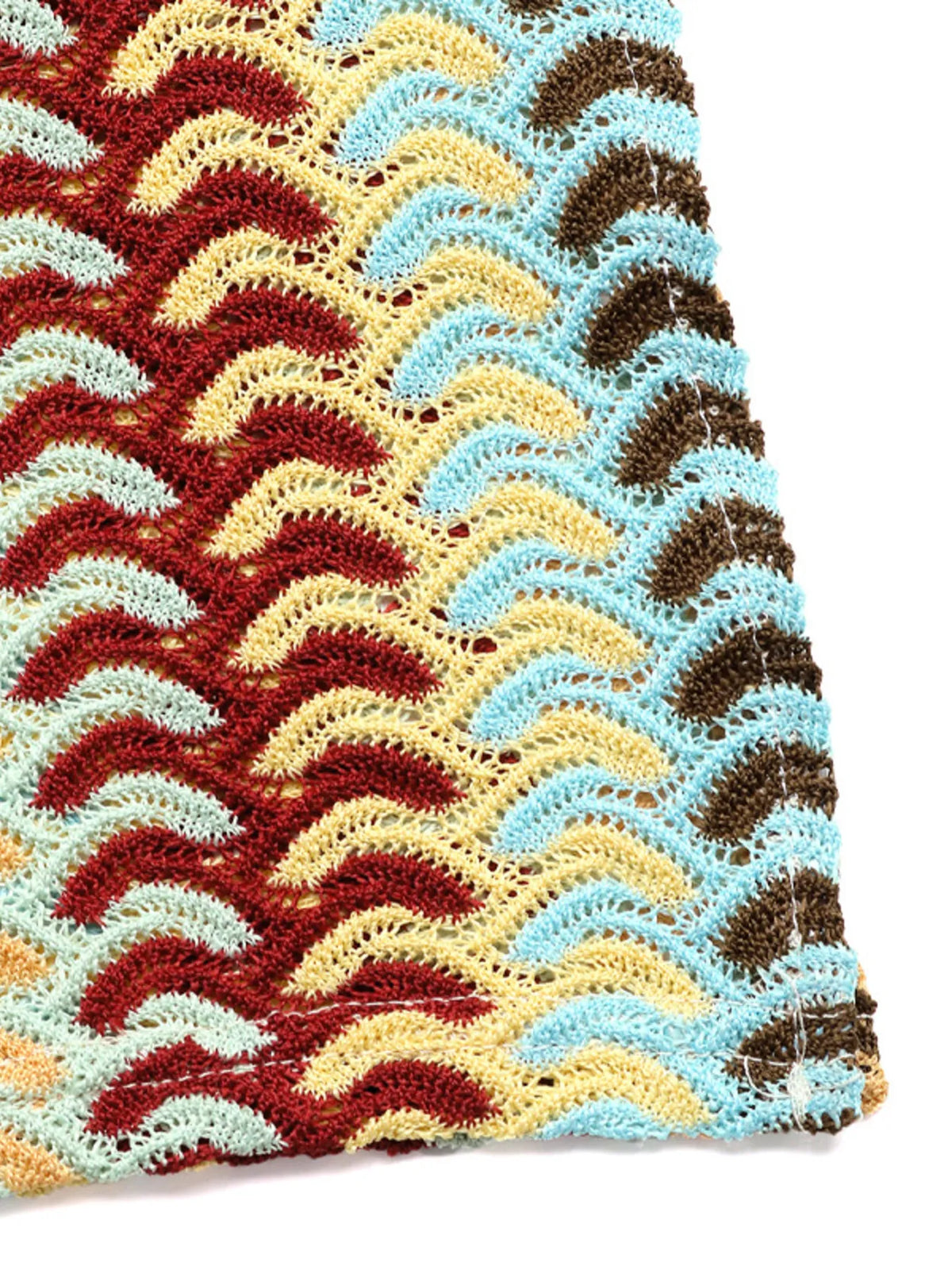 Close view of raised multicolor chevron stitches on khaki knit
