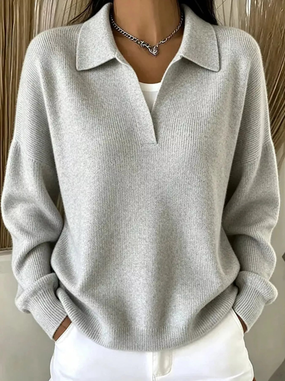 Light gray ribbed polo sweater modeled front view with hands in pockets