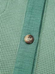 Close-up of front placket and textured fabric