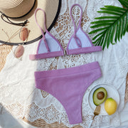Lavender ribbed bikini set with white-lined cups arranged flat