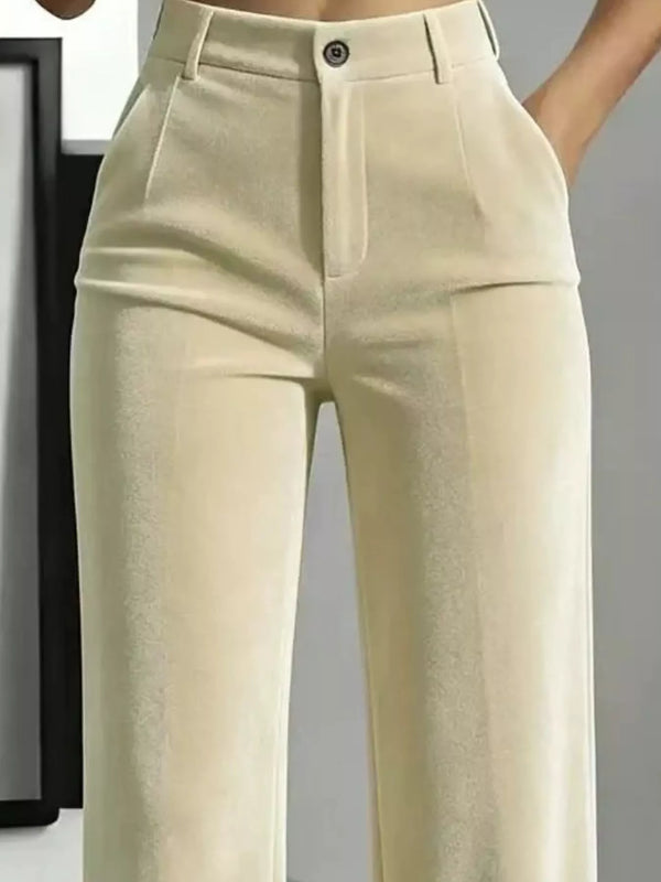 Close front detail of cream velvet pants showing button waist, belt loops and pockets