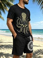 Black graphic tee and shorts set shown at an angle, with octopus print on the shirt and emblem on the shorts.