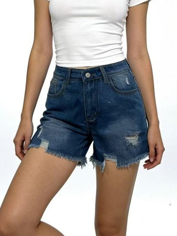 Dark blue raw-hem denim shorts showing distressed thigh patches and a button waist, angled front view