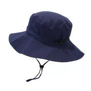 Angled view of a navy bucket hat showing the brim and adjustable cord toggle.