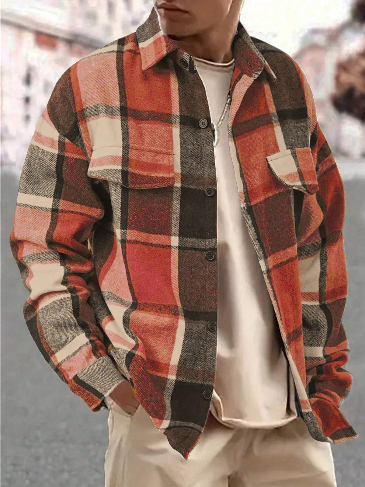 Front view of a gray plaid button-up shirt with two chest pockets