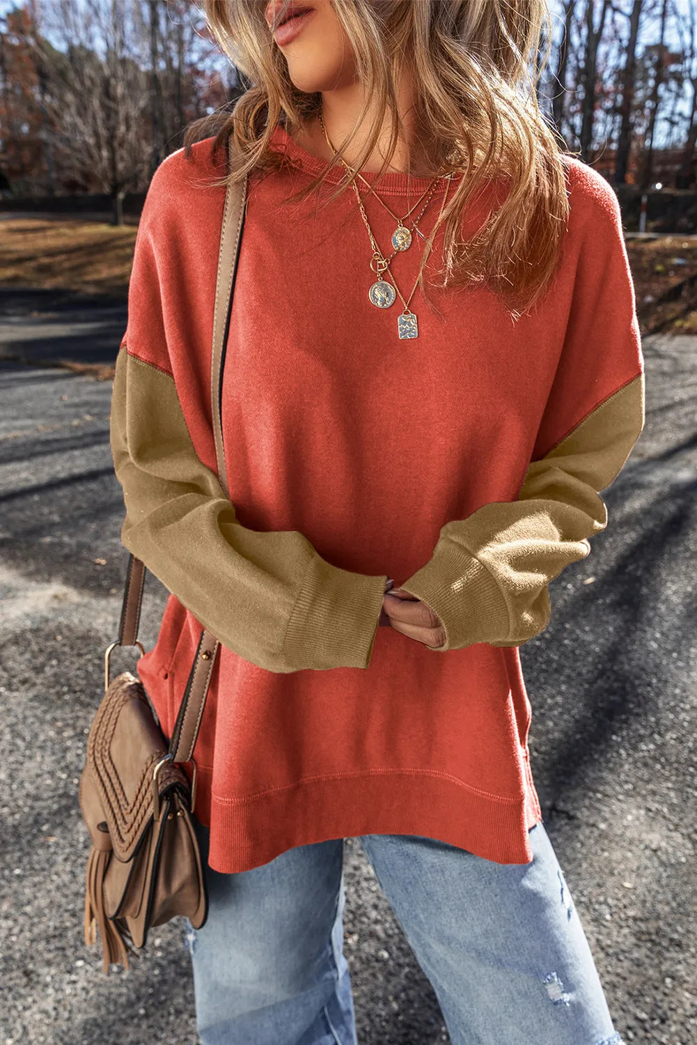 Front view of rust and tan contrast sweatshirt