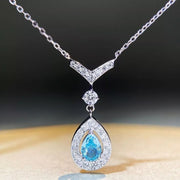 Teardrop pendant necklace in pastel blue displayed on a bust