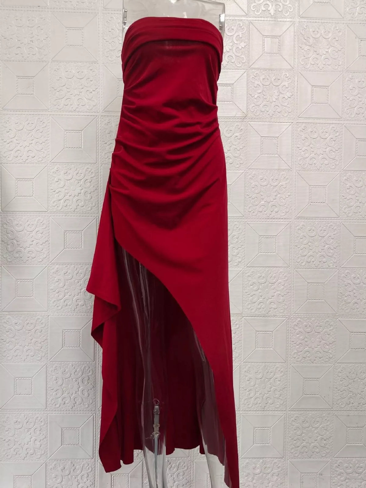 Black maxi dress showing thigh-high slit and draped skirt