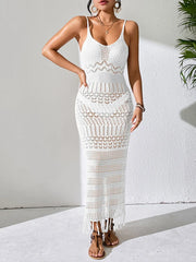 Front view of a white openwork cover-up dress with thin straps and a fringed hem
