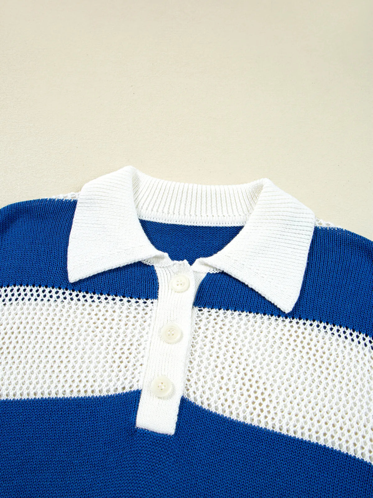 Close-up of white collar and button placket