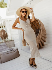 Side view of white sweater dress with openwork panel and side slit