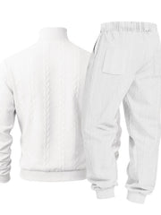 White cable-knit sweater and joggers displayed flat from the back.