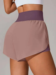 Rear side view of taupe-pink shorts with purple waistband