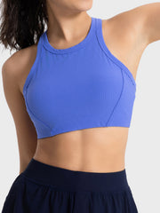 Bright blue cropped sport tank, angled front view