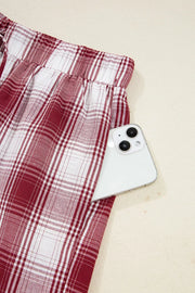 Close detail of plaid shorts elastic waistband and drawstring