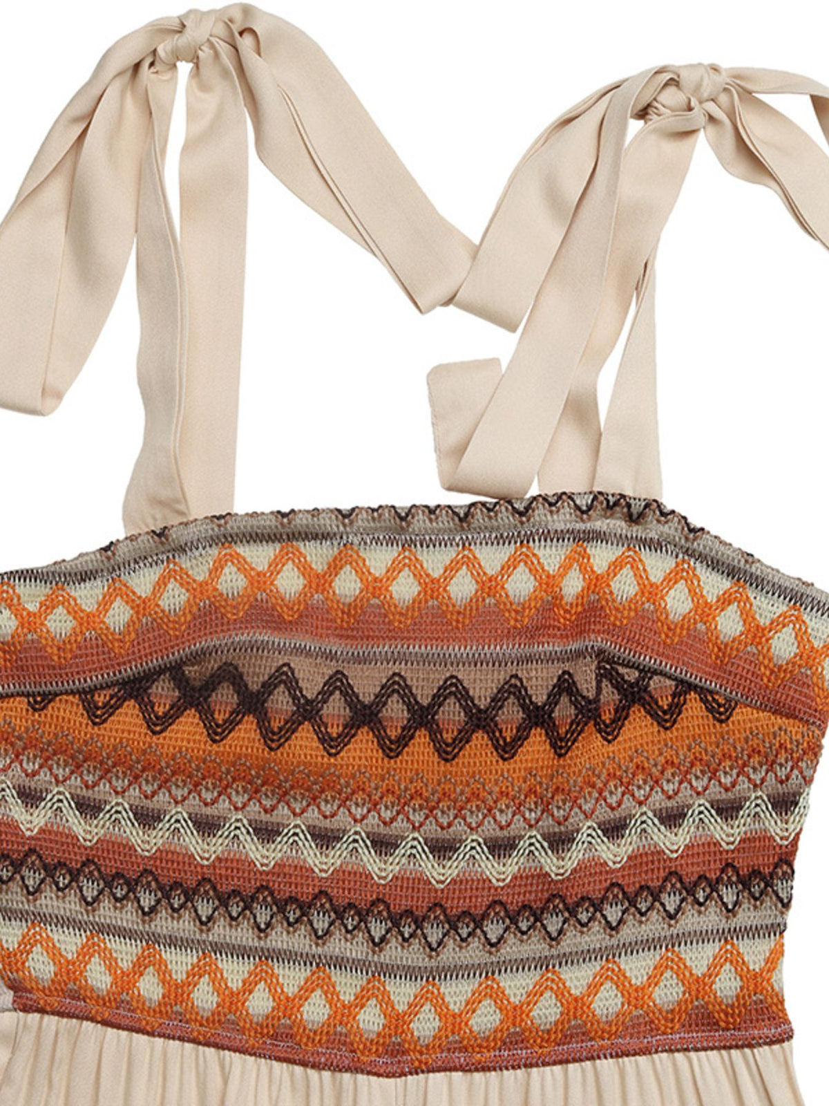 Close-up of adjustable shoulder ties and patterned bodice