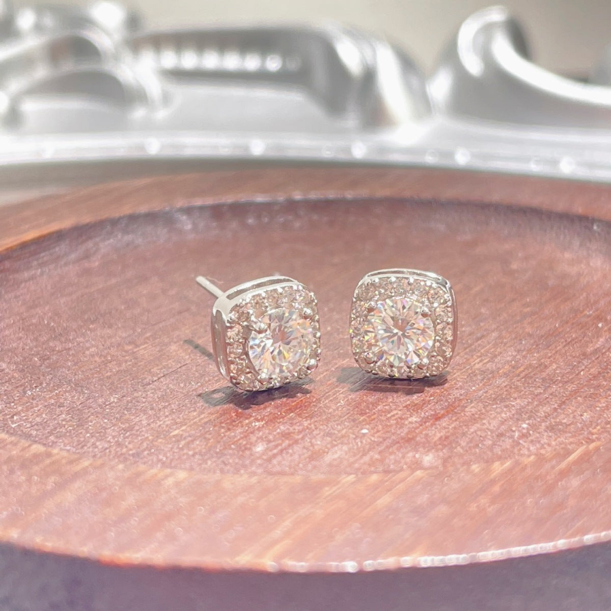1 carat moissanite stud earrings in 925 sterling silver, close-up view