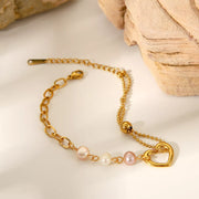 Pearl bracelet shown with its gold chain extension