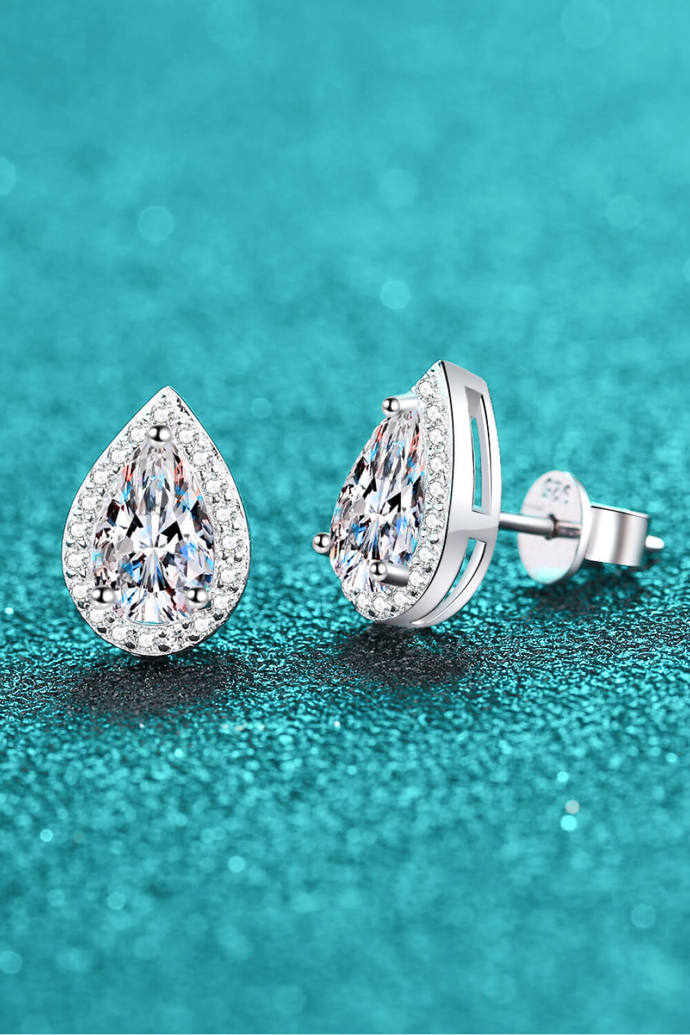 Pair of teardrop stone studs shown from the side