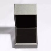 Open presentation box for the yellow moissanite stud earrings.