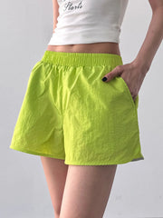Three-quarter front view of elastic waist active shorts