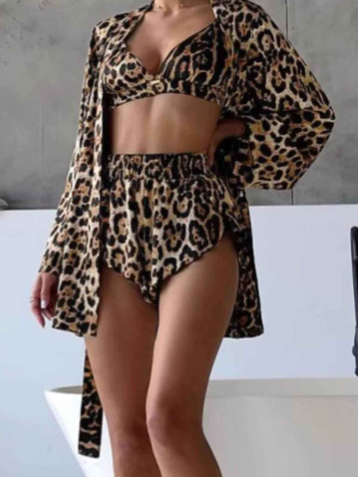 Model wearing the leopard-print bra, shorts and open tie cardigan