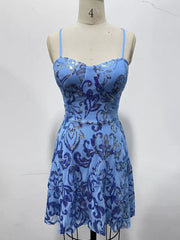 Light blue floral-sequin mini dress displayed on a dress form.