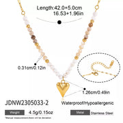 Gold-tone heart bead necklace with length and pendant measurement graphic