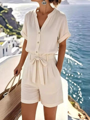 Front view of the white button-down shirt and shorts set with a tied waist.