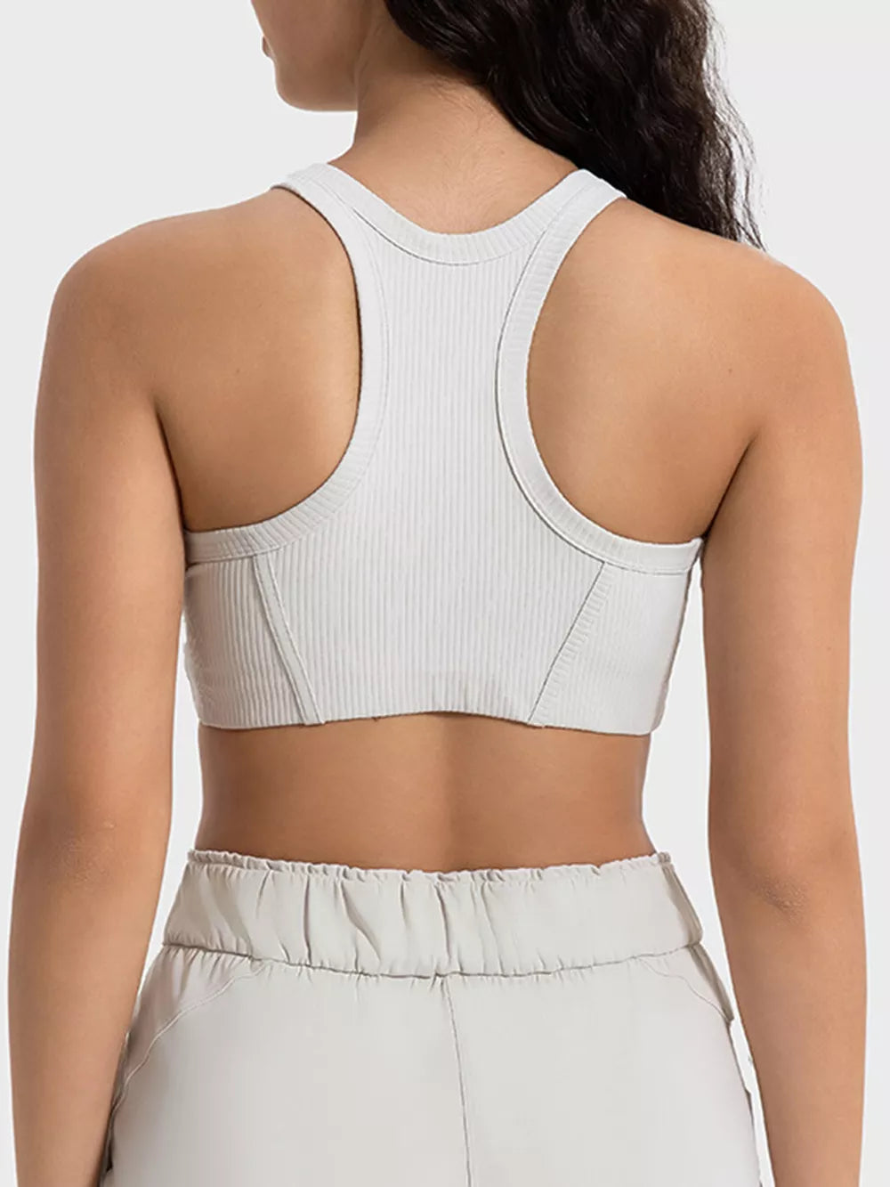 White cropped sport tank showing racerback straps