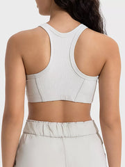 White cropped sport tank showing racerback straps