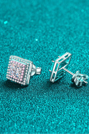 Square stone stud and post backs shown on teal surface