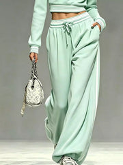 Mint green matching pants showing drawstring waist and side pockets