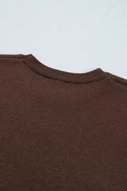 Close-up of plain brown tee back neckline and neck seam