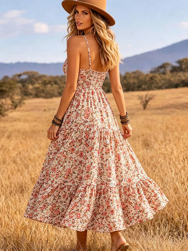 Back view of pink floral midi dress with thin straps and flared skirt